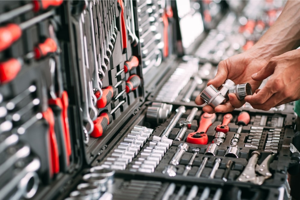 hands going through large toolbox