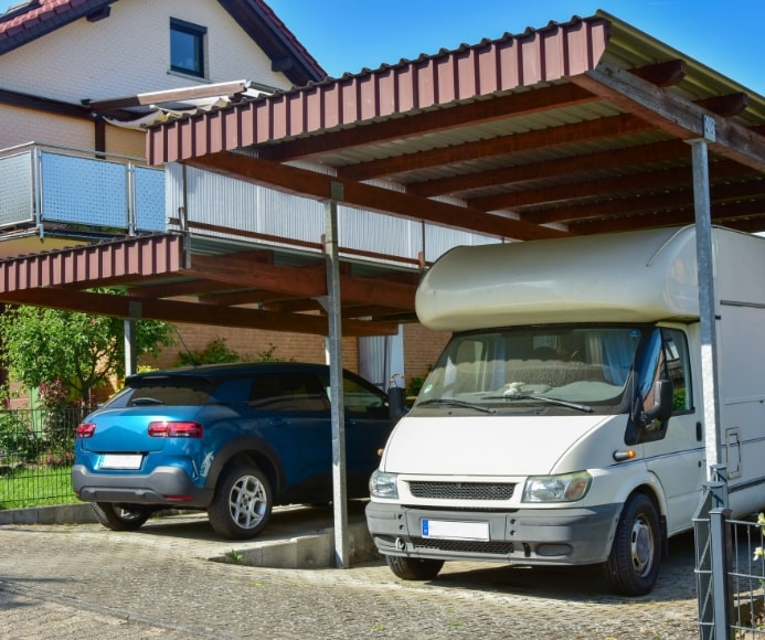 carport with car and van inside