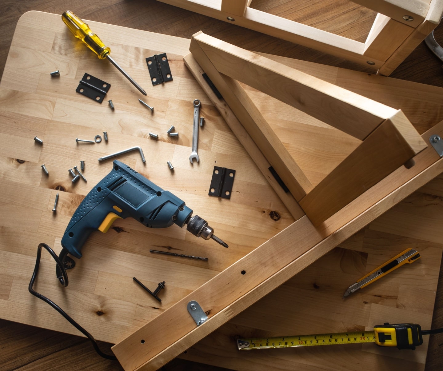 rill tool and another equipment on wood table furniture